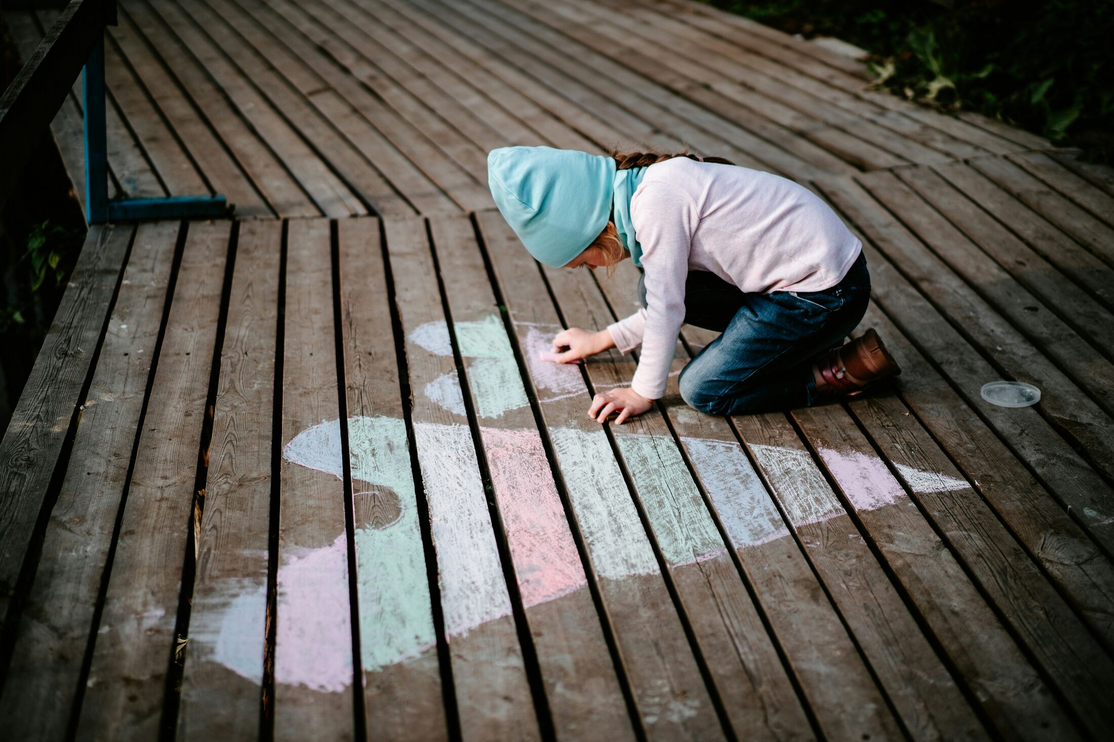 A child writing with chalk